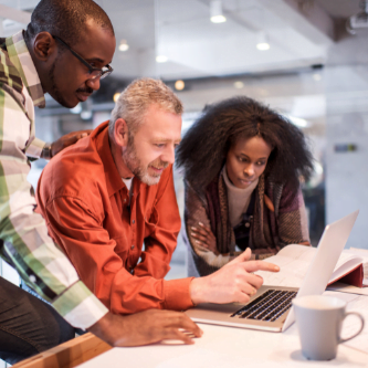 Three professionals analyzing business finances